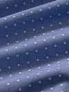 Close-up of blue fabric with white geometric pattern
