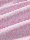 Pink and white floral patterned fabric