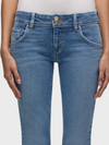 Blue jeans worn by a person on a white background